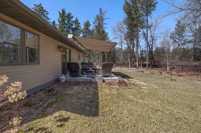 view of yard featuring fence and a patio