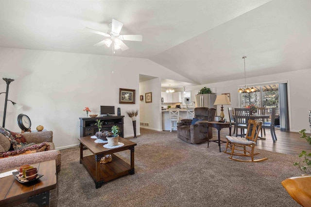 carpeted living area featuring lofted ceiling, visible vents, baseboards, and ceiling fan with notable chandelier