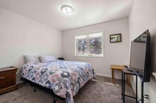 carpeted bedroom featuring baseboards