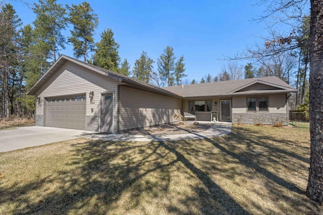 ranch-style home with a garage, driveway, stone siding, and a front yard
