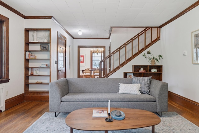 491 Burlington Rd, Saint Paul, MN 55119 - living area featuring crown molding, wood finished floors, a chandelier, and stairway
