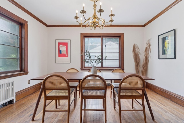 491 Burlington Rd, Saint Paul, MN 55119 - dining area with a chandelier, light wood-type flooring, radiator, and ornamental molding