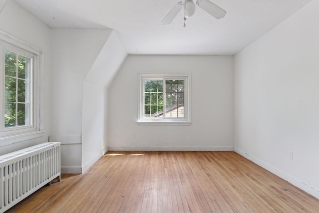 491 Burlington Rd, Saint Paul, MN 55119 - additional living space featuring radiator heating unit, hardwood / wood-style floors, a ceiling fan, and lofted ceiling