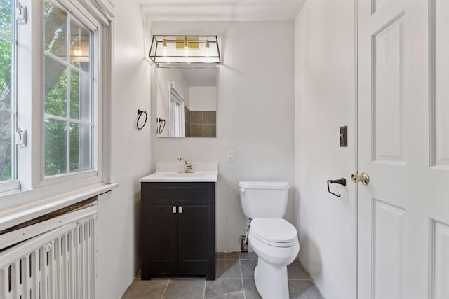 491 Burlington Rd, Saint Paul, MN 55119 - bathroom featuring radiator heating unit, vanity, and tile patterned floors