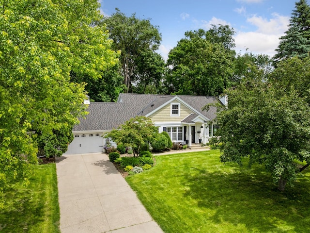 5048 Kent Ave, Edina, MN 55436 - view of front of home featuring concrete driveway, an attached garage, a front lawn, a chimney, and view of scattered trees