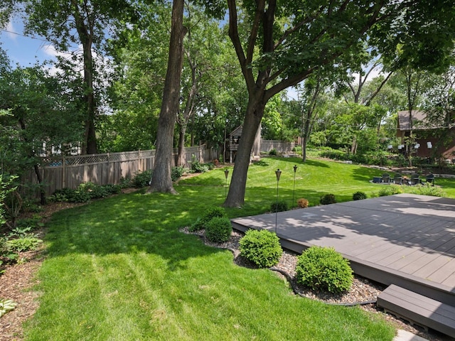 5048 Kent Ave, Edina, MN 55436 - view of yard featuring a wooden deck and view of wooded area