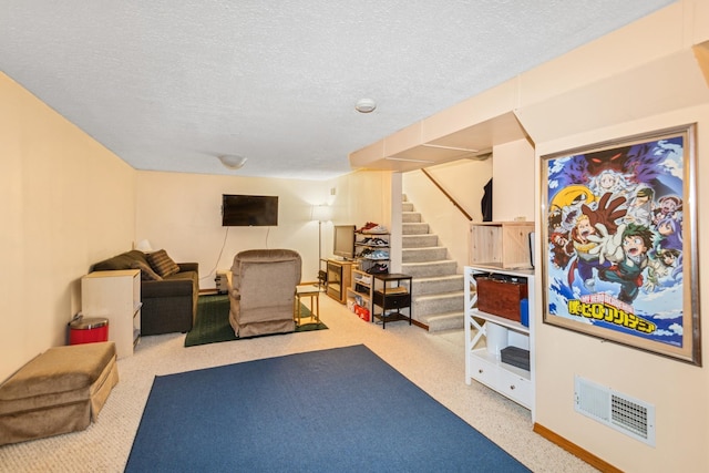 interior space with carpet flooring, a textured ceiling, visible vents, and baseboards