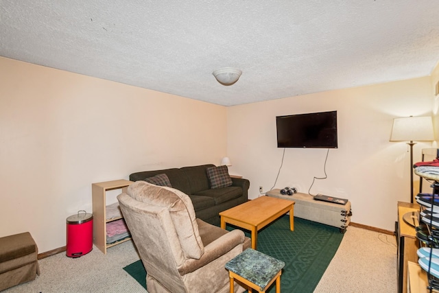 living room featuring carpet floors, a textured ceiling, and baseboards
