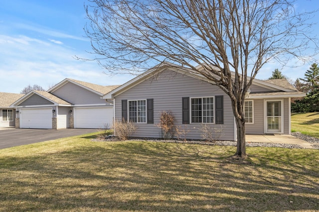 8569 Telford Ln N, Brooklyn Park, MN 55443 - single story home with an attached garage, asphalt driveway, a front yard, and a shingled roof