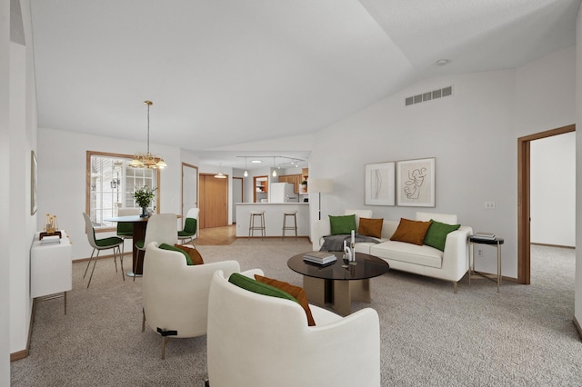 8569 Telford Ln N, Brooklyn Park, MN 55443 - carpeted living area with lofted ceiling, baseboards, and a chandelier