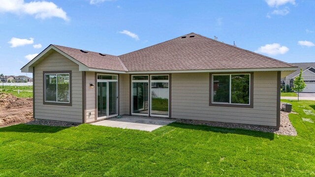 17729 Everest Ave, Lakeville, MN 55044 - back of house with a yard, roof with shingles, and central AC unit