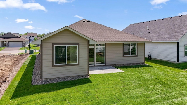 17729 Everest Ave, Lakeville, MN 55044 - rear view of house featuring a lawn, a patio area, and roof with shingles