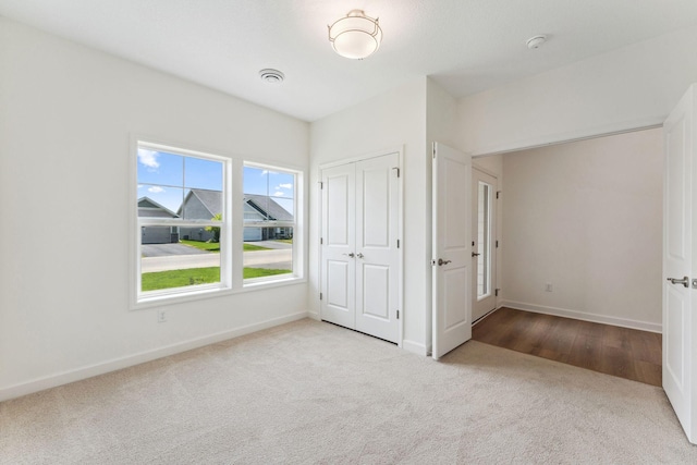 17729 Everest Ave, Lakeville, MN 55044 - unfurnished bedroom with carpet flooring, baseboards, and a closet