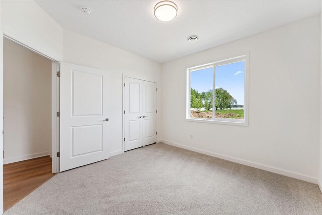 17729 Everest Ave, Lakeville, MN 55044 - unfurnished bedroom featuring baseboards and carpet flooring