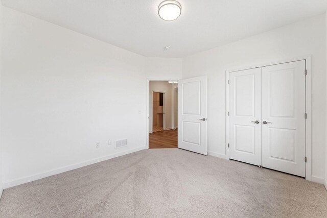 17729 Everest Ave, Lakeville, MN 55044 - unfurnished bedroom featuring carpet, baseboards, and a closet