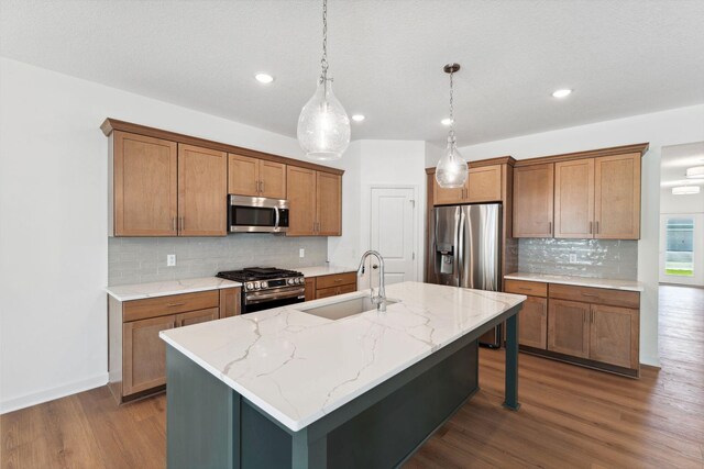 17729 Everest Ave, Lakeville, MN 55044 - kitchen featuring appliances with stainless steel finishes, a sink, decorative backsplash, brown cabinets, and recessed lighting
