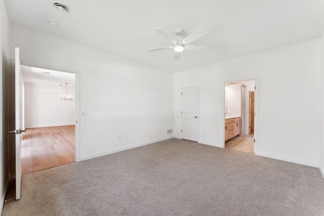 17729 Everest Ave, Lakeville, MN 55044 - unfurnished bedroom with light colored carpet, a chandelier, baseboards, and ensuite bathroom