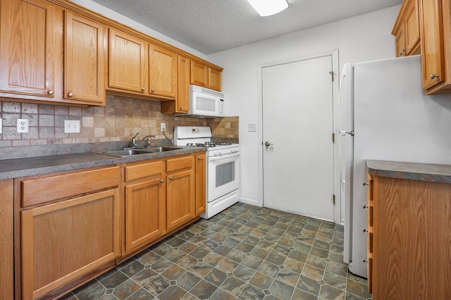1065 Blackbird Trl SW Unit 8, Hutchinson, MN 55350 - kitchen with white appliances, a sink, tasteful backsplash, dark countertops, and a textured ceiling