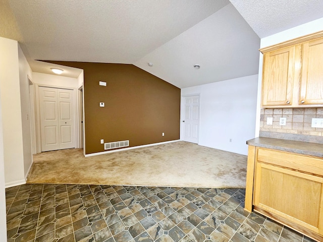 1065 Blackbird Trl SW Unit 8, Hutchinson, MN 55350 - bonus room with dark colored carpet, lofted ceiling, and baseboards