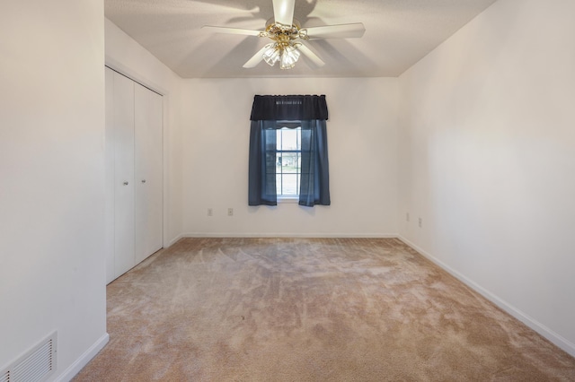 1065 Blackbird Trl SW Unit 8, Hutchinson, MN 55350 - unfurnished bedroom featuring carpet floors, a closet, baseboards, and ceiling fan