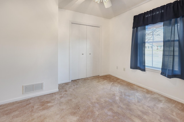 1065 Blackbird Trl SW Unit 8, Hutchinson, MN 55350 - unfurnished bedroom featuring carpet floors, baseboards, and a closet