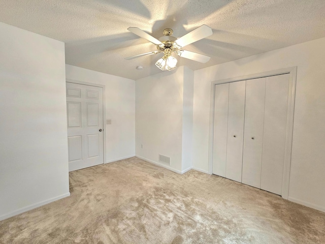 1065 Blackbird Trl SW Unit 8, Hutchinson, MN 55350 - unfurnished bedroom with carpet flooring, baseboards, a textured ceiling, ceiling fan, and a closet
