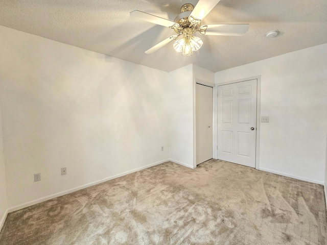 1065 Blackbird Trl SW Unit 8, Hutchinson, MN 55350 - unfurnished bedroom featuring carpet flooring, baseboards, a textured ceiling, and a ceiling fan