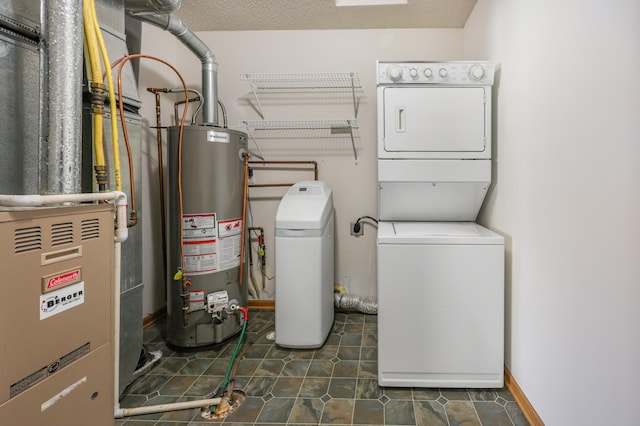 1065 Blackbird Trl SW Unit 8, Hutchinson, MN 55350 - laundry room with water heater, stacked washer / dryer, and heating unit