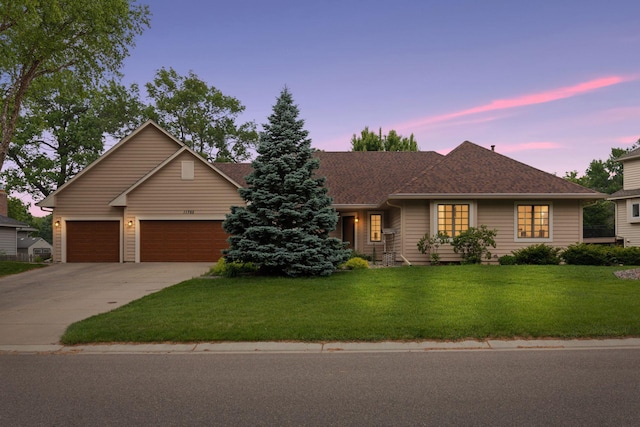 11765 177th St W, Lakeville, MN 55044 - ranch-style house with concrete driveway, a yard, a garage, and roof with shingles