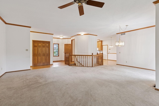 11765 177th St W, Lakeville, MN 55044 - unfurnished room featuring light colored carpet, a ceiling fan, ornamental molding, and a chandelier