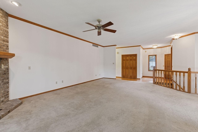 11765 177th St W, Lakeville, MN 55044 - unfurnished living room featuring carpet, a ceiling fan, crown molding, and a fireplace
