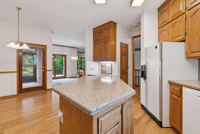 11765 177th St W, Lakeville, MN 55044 - kitchen featuring a chandelier, white appliances, light wood-type flooring, and decorative light fixtures
