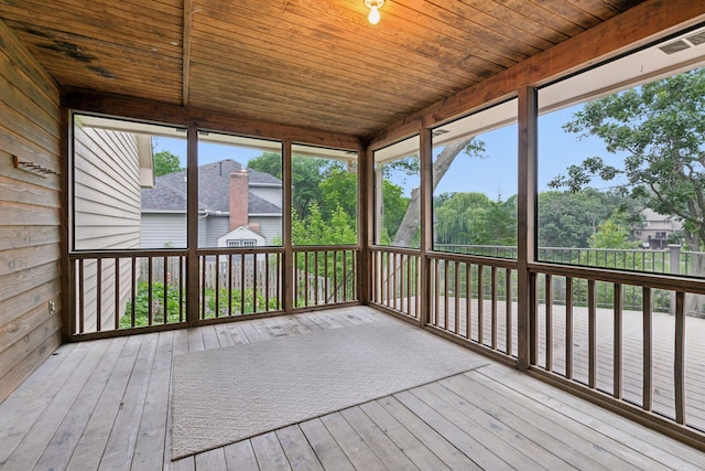 11765 177th St W, Lakeville, MN 55044 - unfurnished sunroom with wood ceiling, hardwood / wood-style flooring, a wooden deck, and wood walls
