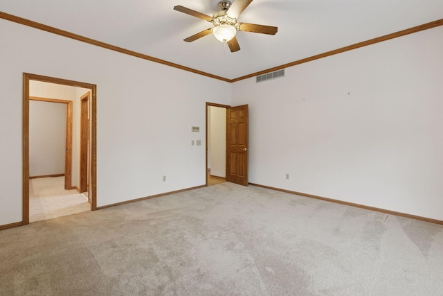 11765 177th St W, Lakeville, MN 55044 - spare room featuring light colored carpet, a ceiling fan, and crown molding