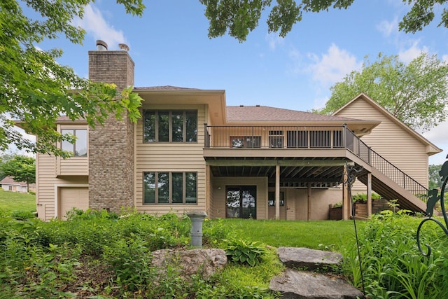 11765 177th St W, Lakeville, MN 55044 - rear view of property with a chimney, a wooden deck, stairs, a garage, and a lawn