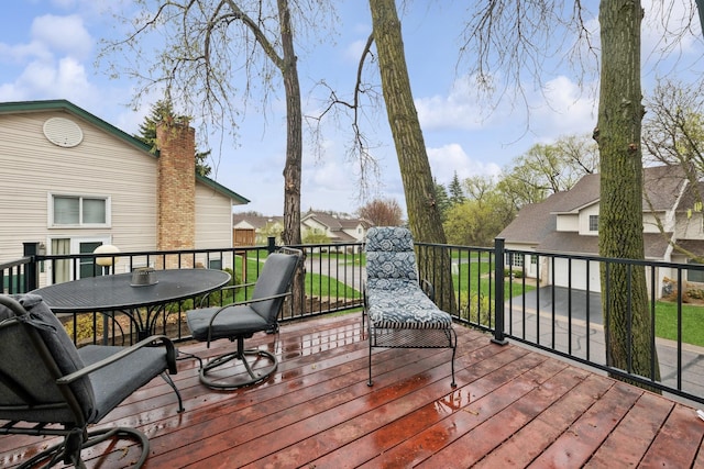 wooden terrace with outdoor dining space