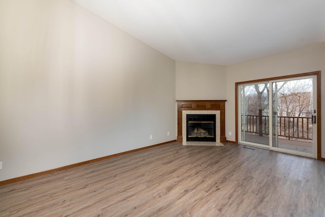 130 Teton Ln Unit 8, Mankato, MN 56001 - unfurnished living room with wood finished floors and a tile fireplace
