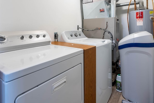 130 Teton Ln Unit 8, Mankato, MN 56001 - laundry room featuring washer and dryer, light wood-style flooring, and heating unit