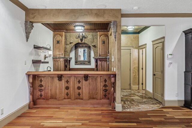 1801 Elliot Ave Unit 4And 6, Minneapolis, MN 55404 - bar area with wood finished floors, ornamental molding, a sink, and baseboards