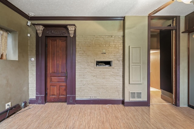 1801 Elliot Ave Unit 4And 6, Minneapolis, MN 55404 - spare room featuring wood finished floors, a textured ceiling, ornamental molding, and baseboards