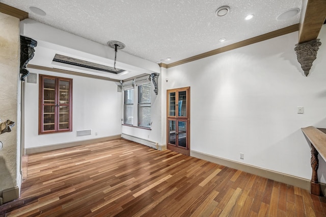 1801 Elliot Ave Unit 4And 6, Minneapolis, MN 55404 - unfurnished living room featuring crown molding, baseboard heating, wood finished floors, a textured ceiling, and baseboards