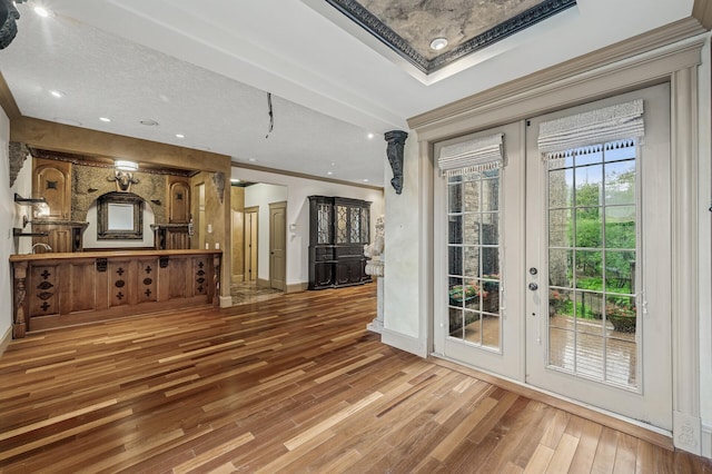 1801 Elliot Ave Unit 4And 6, Minneapolis, MN 55404 - unfurnished living room featuring french doors, wood finished floors, baseboards, and crown molding
