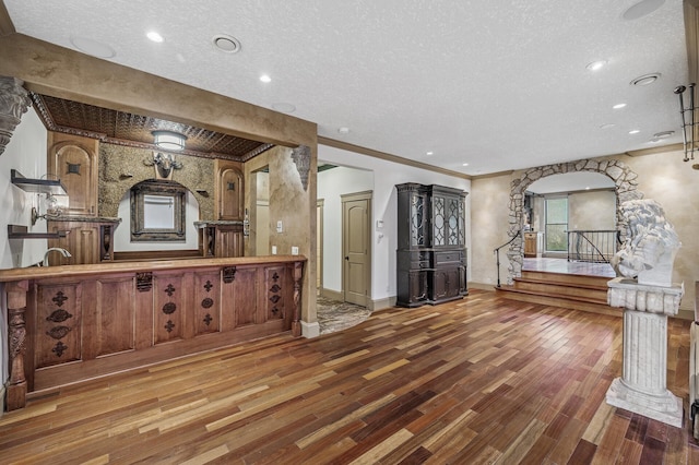 1801 Elliot Ave Unit 4And 6, Minneapolis, MN 55404 - kitchen featuring a textured ceiling, wood finished floors, crown molding, decorative columns, and recessed lighting