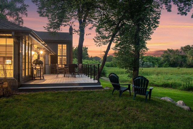 461 Peavey Ln, Wayzata, MN 55391 - yard at dusk with a deck and a yard