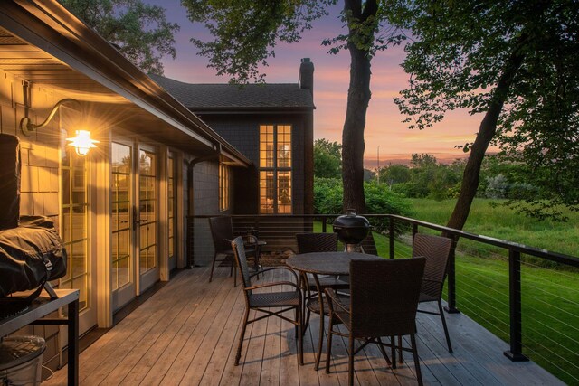 461 Peavey Ln, Wayzata, MN 55391 - wooden deck featuring outdoor dining space, a grill, and french doors