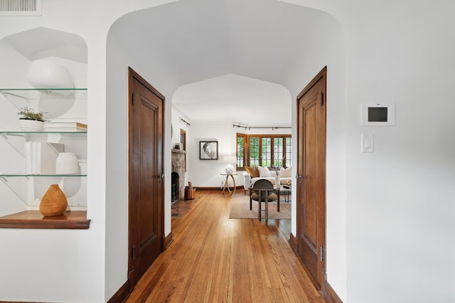 hallway featuring light wood-style floors