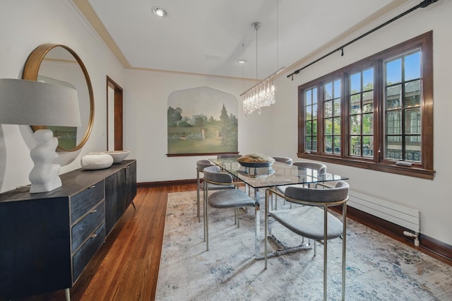 dining area with wood finished floors, baseboards, recessed lighting, and crown molding