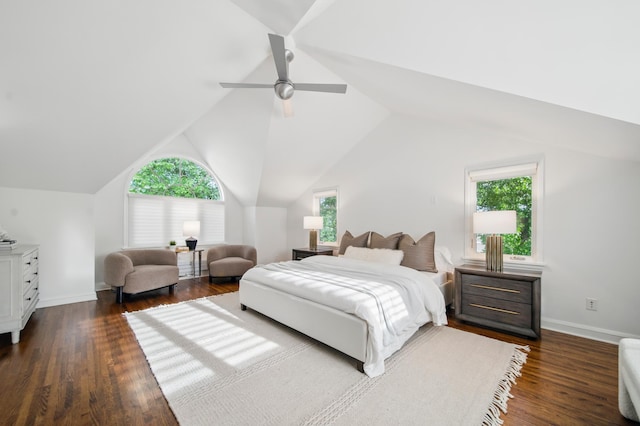 bedroom featuring multiple windows, dark wood-style floors, lofted ceiling, a ceiling fan, and baseboards