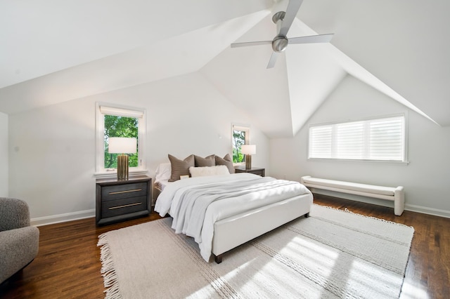 bedroom featuring multiple windows, dark wood-style floors, ceiling fan, vaulted ceiling, and baseboards