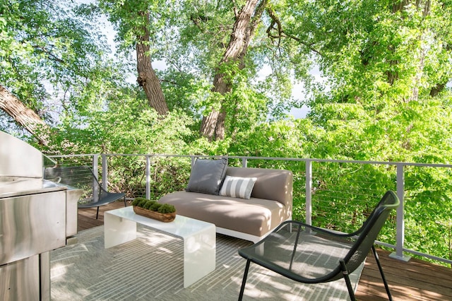 wooden terrace with outdoor lounge area